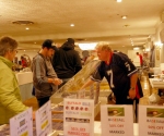 vendor and crowd looking at tables